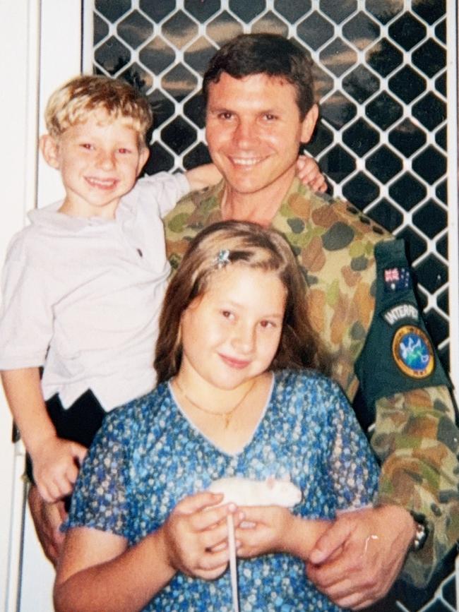 Bruce Armstrong with his children on return from a deployment to East Timor.