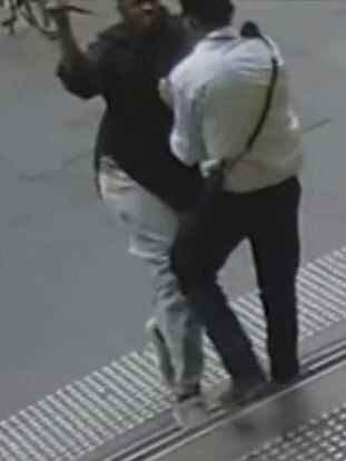 CCTV footage shows a 24-year-old security guard being stabbed in the neck by assailant Hassan Khalif Shire Ali during the Bourke St rampage. Picture: Nine News