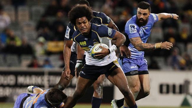 CANBERRA, AUSTRALIA - JULY 11: Henry Speight of the Brumbies is tackled during the round 19 Super Rugby match between the Brumbies and the Force at Canberra Stadium on July 11, 2014 in Canberra, Australia. (Photo by Stefan Postles/Getty Images)