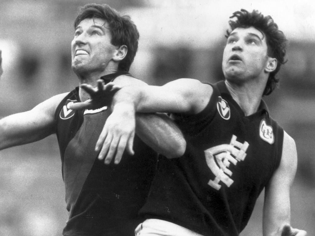 Justin Madden (left) knows all about the Carlton-Essendon rivalry and playing against his brother Simon (right).