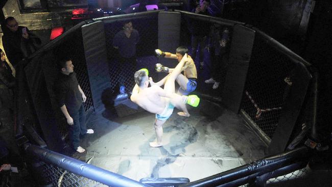 Two fighters battle in the cage at the real-life Fight Club. Picture: CEN/Australscope