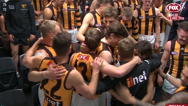 Sam Mitchell and his players embrace following their devastating semi-final loss to Port Adelaide.