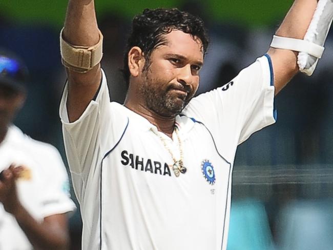 29/07/2010 WIRE: 29/07/2010 WIRE: Indian cricketer Sachin Tendulkar raises his bat and helmet as he is applauded by the crowd for completing a double century (200 runs) during the fourth day of the second Test match between Sri Lanka and India at The Sinhalese Sports Club Ground in Colombo on July 29, 2010. Sri Lankan cricketers Muttiah Muralitharan and Lasith Malinga claimed 15 of the 20 Indian wickets in the first Test in Galle last week, which Sri Lanka won by 10 wickets to take a 1-0 lead in the three-match series.AFP PHOTO/ Lakruwan WANNIARACHCHI.