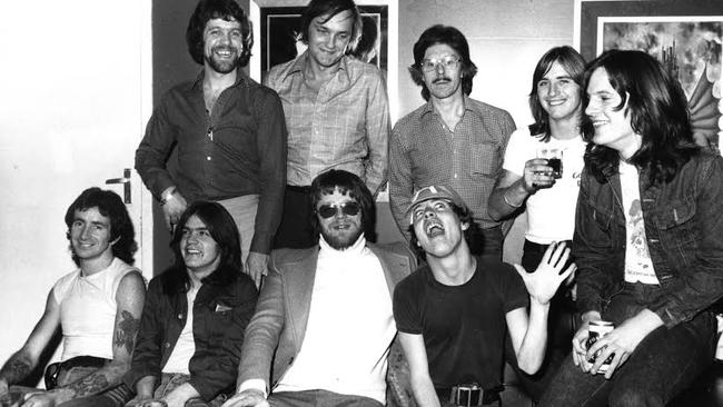 Meet and greet ... AC/DC meet the Beatles’ press officer Derek Taylor (back row, middle)