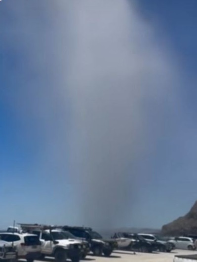 Beachgoers flee a willy-willy at Rapid Bay, south of Adelaide. Picture: 7NEWS