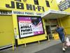 Hits keep coming, but consumers hold their ground