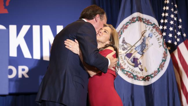 Glenn Youngkin kisses his wife Suzanne as they finish speaking onstage stage at an election-night rally. Picture: AFP