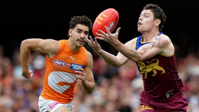 BRISBANE, AUSTRALIA - AUG 11: Lachie Neale of the Lions marks the ball during the 2024 AFL Round 22 match between the Brisbane Lions and the GWS GIANTS at The Gabba on August 11, 2024 in Brisbane, Australia. (Photo by Russell Freeman/AFL Photos via Getty Images)