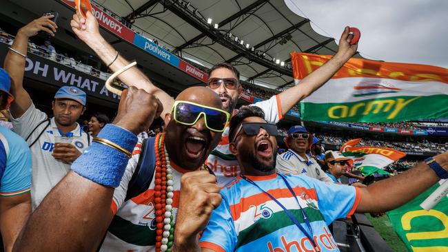 Indian fans celebrate the wicket of Marnus Labuschagne on the second day of the test between India and Australia at The Gabba. Picture Lachie Millard