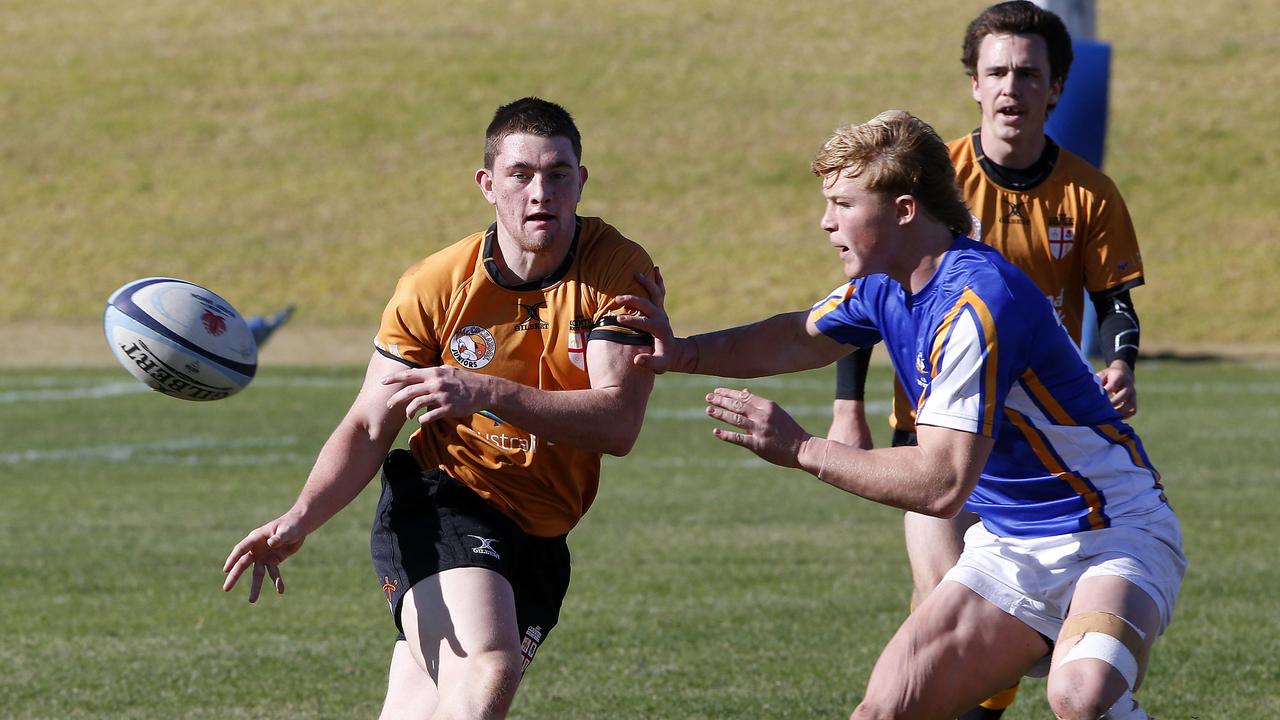 Country's Callum McMenemy offloads the ball. Players at the event come form across Australia and regional and country areas.