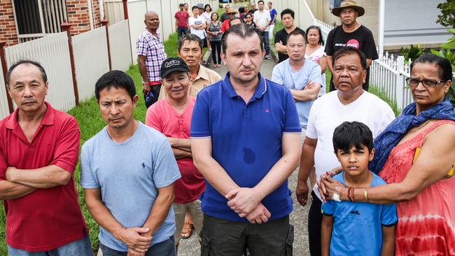 Bonnyrigg residents standing in the unfenced laneway connecting Hollows Place to Montgomery Road. Picture: Carmela Roche