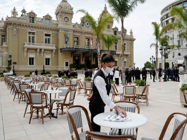 A face mask-wearing waiter at a cafe in Paris. Picture: AFP