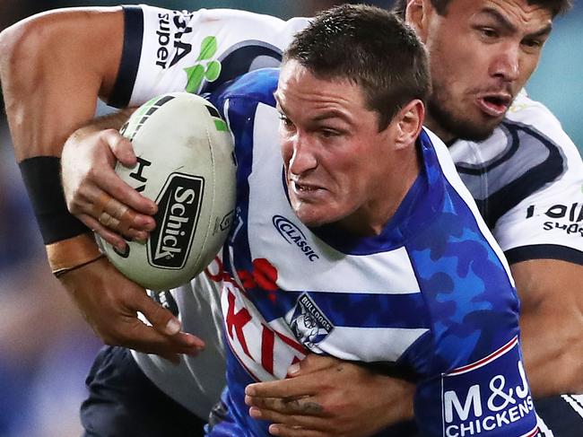 SYDNEY, AUSTRALIA - APRIL 26: Josh Jackson of the Bulldogs is tackled during the round 7 NRL match between the Canterbury Bulldogs and the North Queensland Cowboys at ANZ Stadium on April 26, 2019 in Sydney, Australia. (Photo by Matt King/Getty Images)