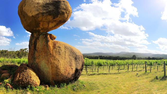 The huge granite boulders among the shiraz vines that inspired the name of Balancing Rock Wines at Stanthorpe.