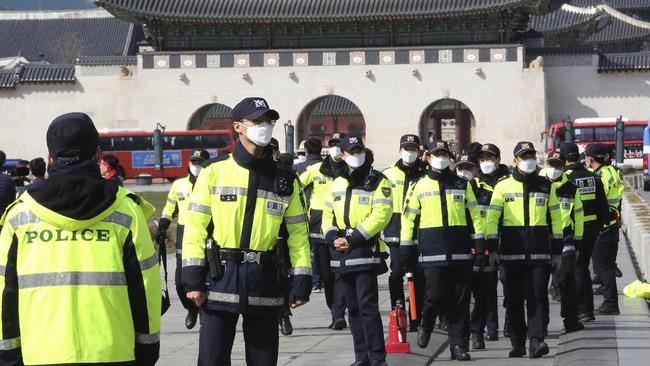 South Korean police officers wearing face masks in Seoul. Picture: AP