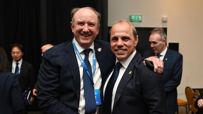 Newly elected World Rugby Chair Dr. Brett Robinson (L) is congratulated by Phil Waugh (R), Rugby Australia CEO following the World Rugby elections at The Marker Hotel on November 14, 2024 in Dublin, Ireland. (Photo by Charles McQuillan - World Rugby/World Rugby via Getty Images)