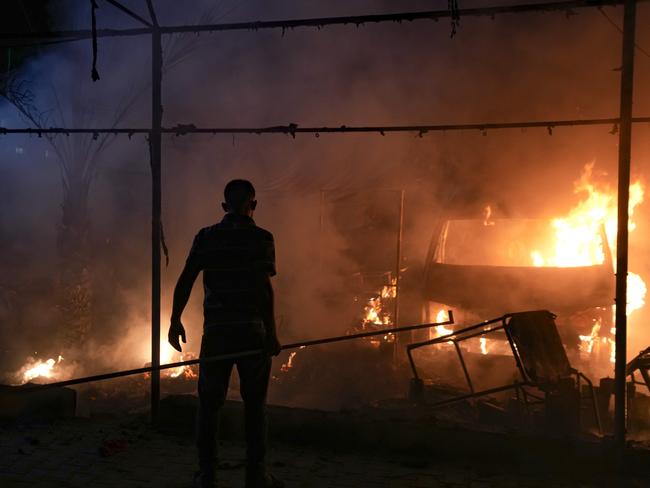 A Palestinian man reacts to a fire after an Israeli strike hit a tent area in the courtyard of Al Aqsa Martyrs hospital in Deir al Balah, Gaza Strip. Picture: AP Photo