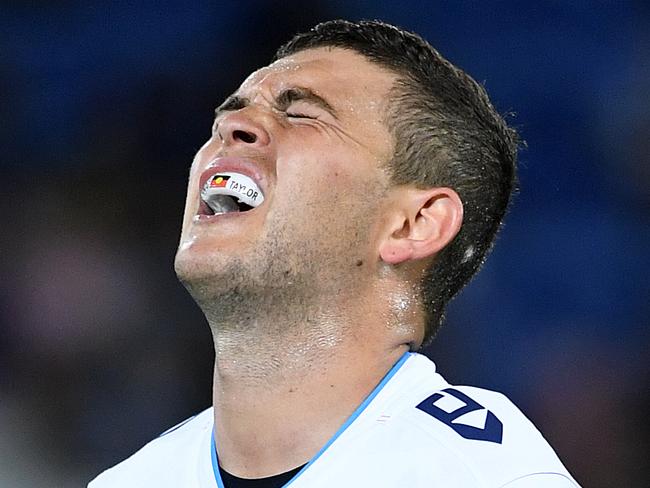 Ashley Taylor  of the Titans grimaces after sustaining an injury during the Round 5 NRL match between the Gold Coast Titans and the Penrith Panthers at CBUS Stadium on the Gold Coast, Friday, April 12, 2019. (AAP Image/Dave Hunt) NO ARCHIVING, EDITORIAL USE ONLY