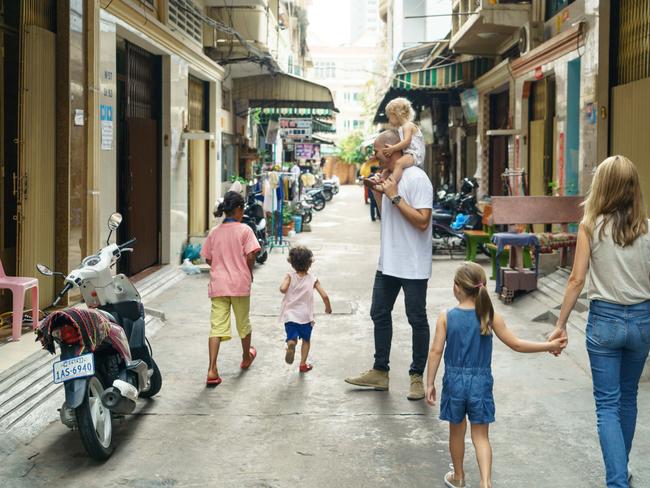 James and Erica Bartle and their family in Cambodia. Pic: Sam Jam.