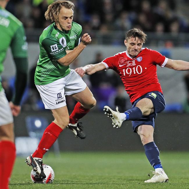 South Hobart's Benjamin Hamlett shoots as Stallions’ Connor Evans blocks. Picture: Zak Simmonds