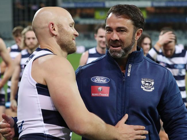 GEELONG, AUSTRALIA - JULY 04: Gary Ablett of the Cats (L) and Geelong Cats Head Coach Chris Scott embrace following victory in the round 5 AFL match between the Geelong Cats and the Gold Coast Suns at GMHBA Stadium on July 04, 2020 in Geelong, Australia. (Photo by Graham Denholm/AFL Photos via Getty Images )