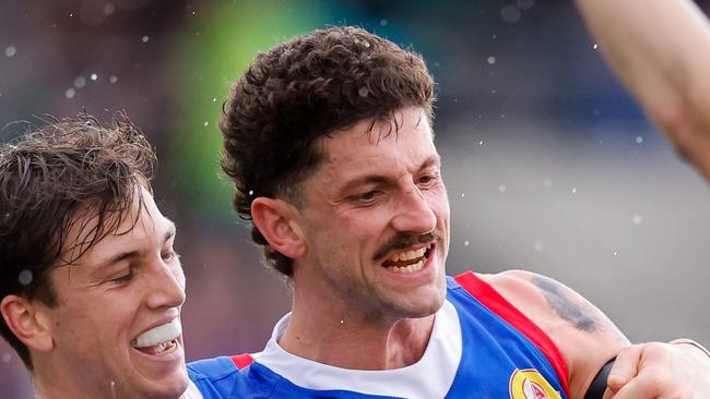 BALLARAT, AUSTRALIA - AUGUST 25: Tom Liberatore of the Bulldogs celebrates a goal with teammate Harvey Gallagher during the 2024 AFL Round 24 match between the Western Bulldogs and the GWS GIANTS at Mars Stadium on August 25, 2024 in Ballarat, Australia. (Photo by Dylan Burns/AFL Photos via Getty Images)