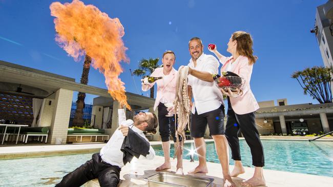 Hellenika owner Simon Gloftis (with octopus) along with staff members Jack Calcraft and Tessa Kelly and fire breather Bryce Watts celebrate their victory. Picture: Nigel Hallett