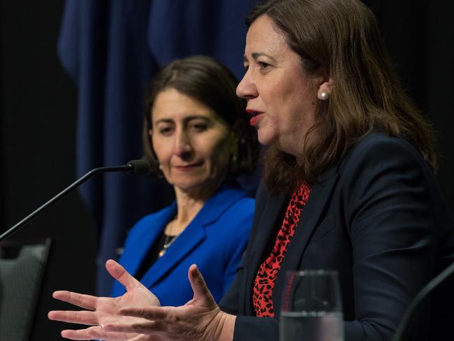 Queensland Premier Annastacia Palaszczuk speaks while her NSW counterpart Gladys Berejiklian looks on.