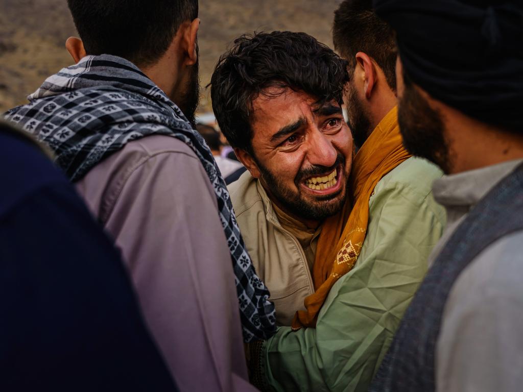 People grieving at the funeral. Picture: Marcus Yam/Los Angeles Times