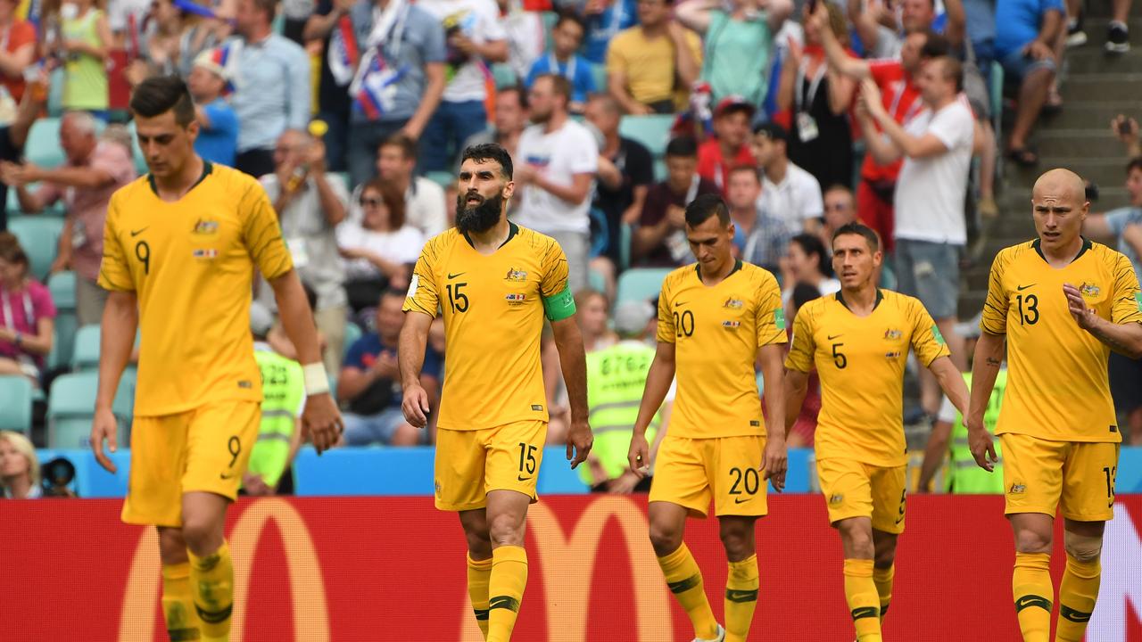 A dejected Australia after Peru scored their second goal.