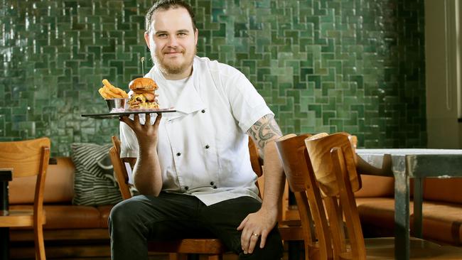 Head chef Brad Johnston with his fancy burger. Picture: Troy Snook