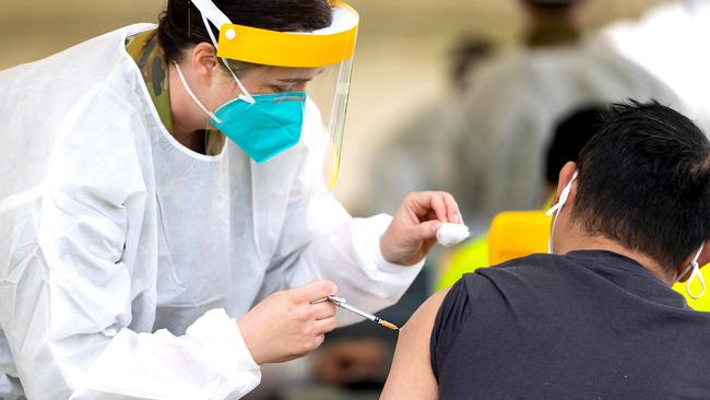 Army Major Bethan Ganderton administers a Covid-19 vaccine at the Dubbo Mass Vaccination centre in western NSW. Picture: ADG