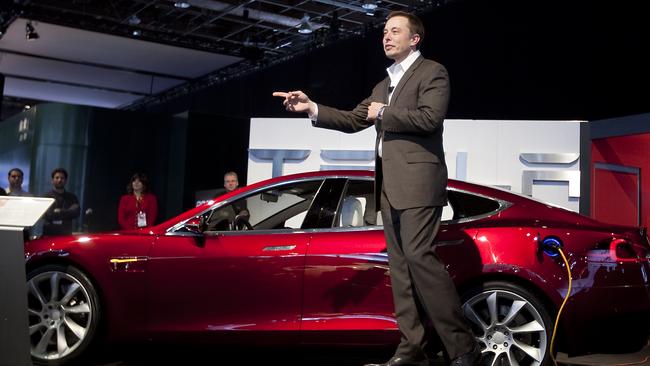 Musk speaks in front of a Tesla Model S electric car on day two of the 2010 North American International Auto Show in Detroit, Michigan. Picture: Daniel Acker/Bloomberg