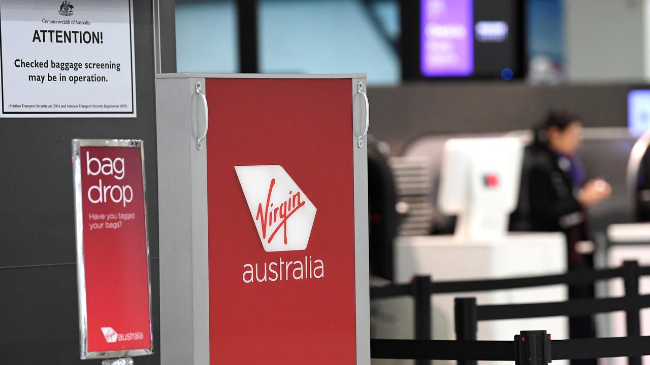 Signage for Virgin Australia is seen at Melbourne Airport in Melbourne, Monday, April 20, 2020. (AAP Image/James Ross) NO ARCHIVING