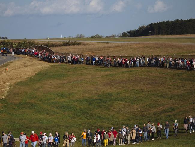 A line of Trump supporters stretches for miles outside Hickory Airport where Donald Trump is rallying for support. Picture: Angus Mordant