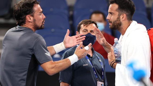 Salvatore Caruso, right, and Fabio Fognini argue after their match Picture: AFP