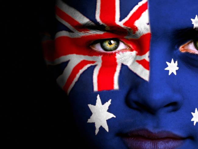 Portrait of a boy with the Australian flag painted on his face