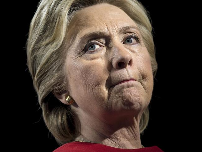 (FILES) This file photo taken on November 07, 2016 shows former Democratic presidential nominee Hillary Clinton pausing while speaking during a rally at the Grand Valley State University Fieldhouse in Allendale, Michigan. Clinton says she is "done" being a political candidate, and that her shock US presidential loss last year to Donald Trump remains a source of deep anguish. "It still is very painful. It hurts a lot," the 2016 Democratic nominee said in an interview on CBS Sunday Morning, the first in a series of appearances to highlight the upcoming publication of "What Happened," her memoir about the campaign. / AFP PHOTO / Brendan Smialowski