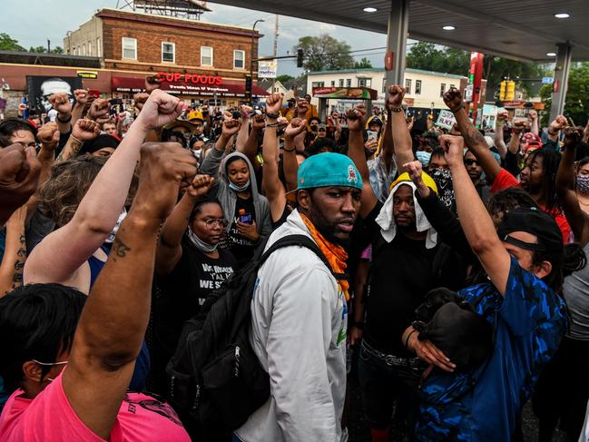 People protest at the makeshift memorial in honour of George Floyd in Minneapolis, Minnesota. Picture: AFP