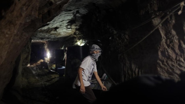 Mohamed Alhwani, a 12-year-old Palestinian refugee who lives near the Egyptian border in the southern Gaza Strip, is a smuggler who spends six hours a day at 'work' inside the tunnels bringing goods from Egypt.