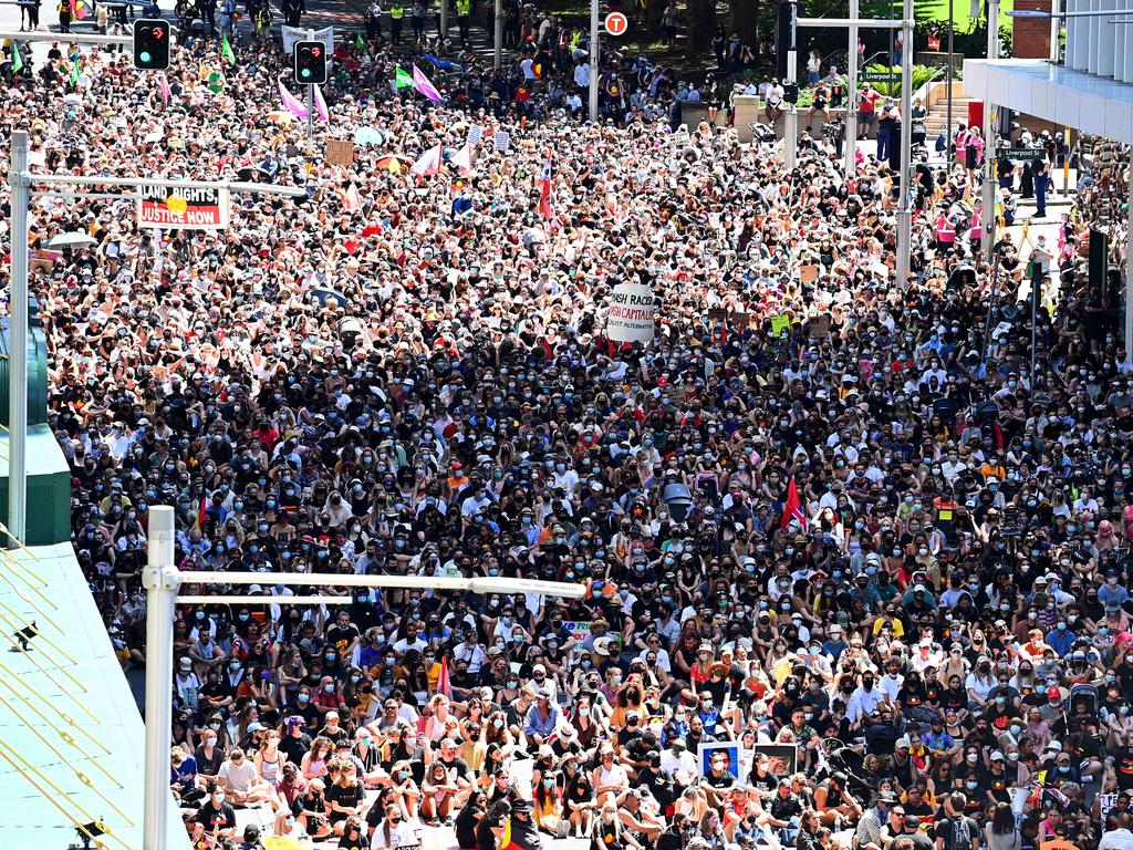 Invasion Day rally swarms Sydney while others take to beaches to