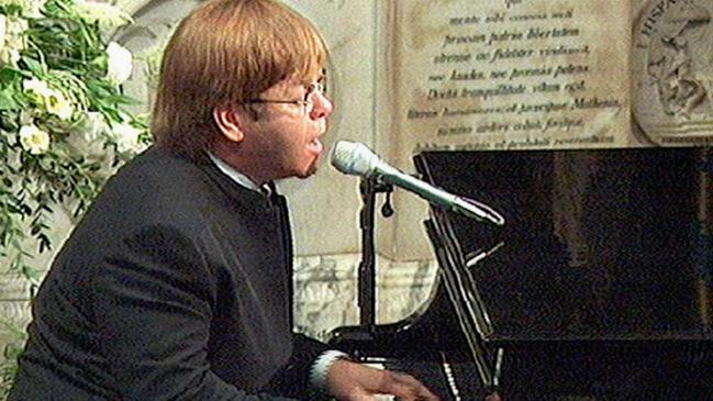 Elton John singing "Candle in the Wind" at the funeral of Princess Diana in 1997.