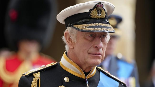 WINDSOR, ENGLAND - SEPTEMBER 19: King Charles III follows the hearse with the coffin of Queen Elizabeth II moving towards St. George's Chapel at Windsor Castle during the State Funeral of Queen Elizabeth II on September 19, 2022 in Windsor, England. Elizabeth Alexandra Mary Windsor was born in Bruton Street, Mayfair, London on 21 April 1926. She married Prince Philip in 1947 and ascended the throne of the United Kingdom and Commonwealth on 6 February 1952 after the death of her Father, King George VI. Queen Elizabeth II died at Balmoral Castle in Scotland on September 8, 2022, and is succeeded by her eldest son, King Charles III. (Photo by Jon Super - WPA Pool/Getty Images)