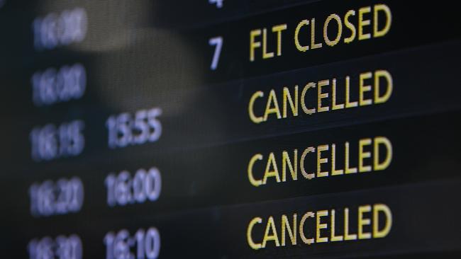 A flight information board showing several cancelled flights, at Sydney Domestic Airport. Picture: AAP Image/James Gourley.