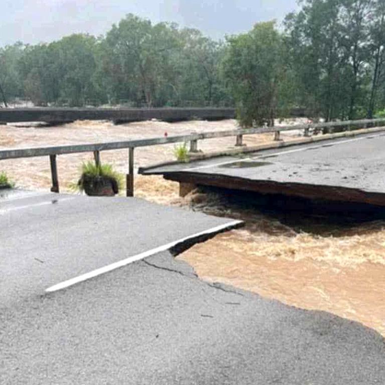 Ollera Creek Bridge cut in half from flood water on the Bruce Highway north of Townsville.