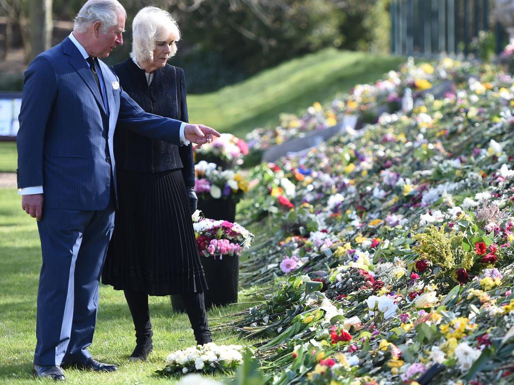 Prince Charles and Camilla visit the gardens of Marlborough House, London, to view the flowers and messages left by members of the public. Picture: Jeremy Selwyn - WPA Pool/Getty Images)