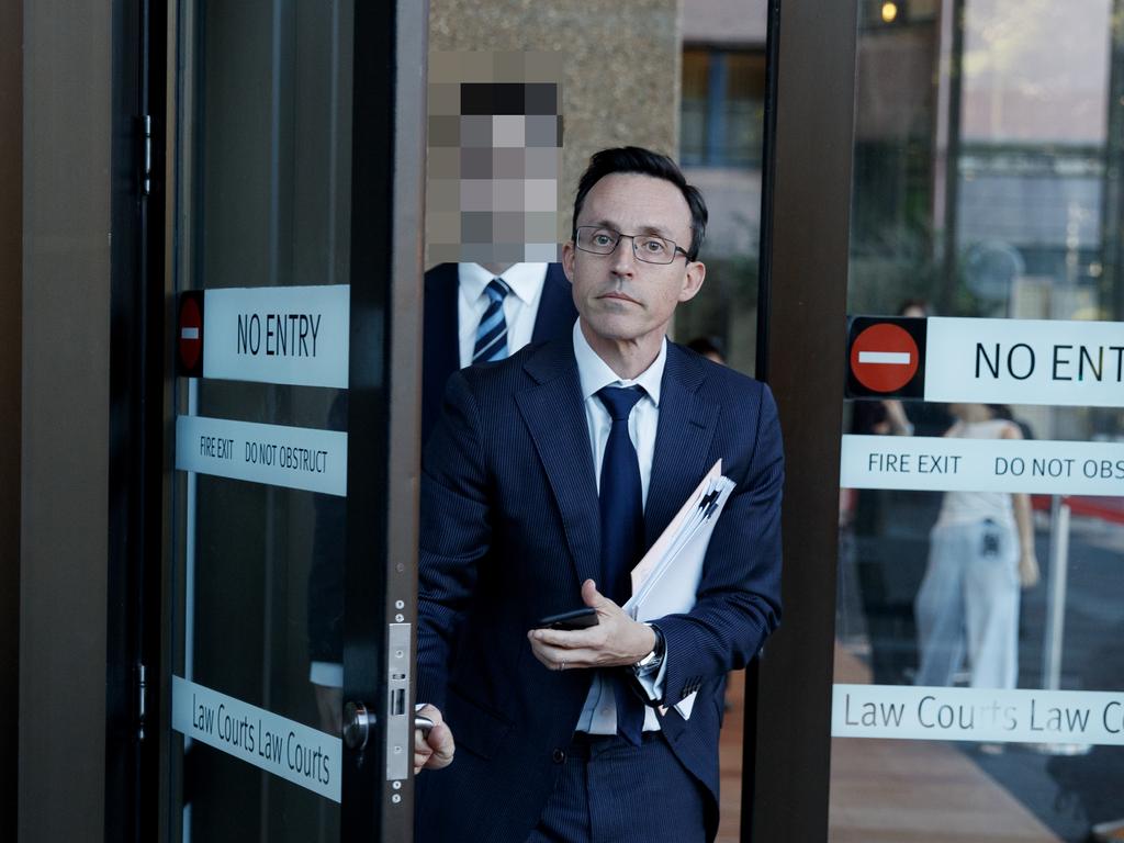 Student A (rear), whose identity is suppressed, leaves the Supreme Court with his lawyer Justin Pennay on Wednesday. Picture: NewsWire / Nikki Short