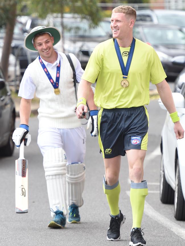 Josh Caddy (right) dressed as an AFL umpire. Picture: Tony Gough