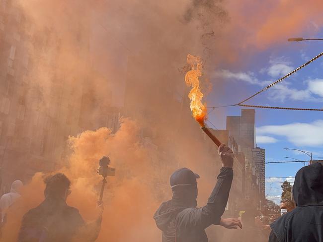 Several flares were lit by protesters. Picture: Suzan Delibasic