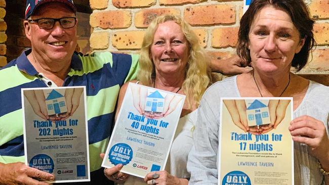 Debbie Weaver (middle) and former Lawrence Tavern owners John and Sally Hoy hold up certificates from the Tavern's three previous years fundraising for the Leukaemia Foundation. Picture: Contributed